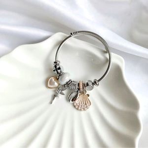 Heart, mermaid, and sea shell detailed pandora model bracelet